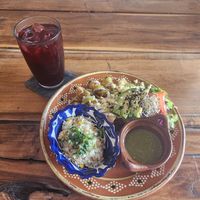 Tacos with rice on the side, green salsa and hibiscus drink at Plantivoros in Playa Del Carmen