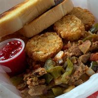 Vegan Italian Sausage Scramble: Potatoes, Green Peppers, Onions, Salsa with Potato Cakes (upcharge) and Sourdough Bread at Studio Grill in Kalamazoo