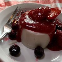 Panna Cotta w/ Berry Compote & mixed Berries. It's so good, we had it FIVE times during the challenge!  We wish it was on their regular menu!  (Kalamazoo Vegan Chef Challenge 5/25) at Studio Grill in Kalamazoo