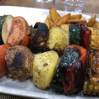 Vegetables kebab with homemade fried potatoes and rice   at Atlético in Faial