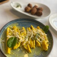 The pumpkin rolls (fritters) and pistachio homemade pasta. at Era in Tirana