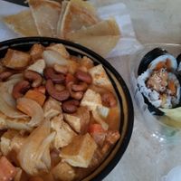 The thai-namite curry with tofu, a side of roti, and tempura sweet potato sushi. at Thai-Namite in Wauwatosa