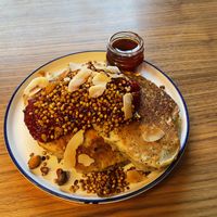 Poppy seeds and lemon pancakes with berry chia seed jam and maple syrup  at Kolm Tilli in Tartu