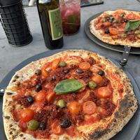 Nduja pizza and blackcurrant Cuba mojito   at Kolm Tilli in Tartu