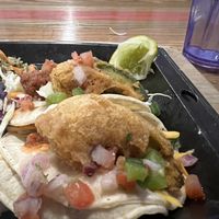 I took the picture when this was half eaten, but this is the fried avocado tacos. I asked for salsa and vegan sour cream on the side, which they happily provided at no extra cost.  at Nacho Daddy in Salt Lake City