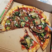 Takeaway vegetable pizza (I added the vegan feta and the basil) at Pizzeria Martinelli in Ronzo Chienis