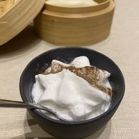 Chinese steamed bun in a bamboo basket with whipped coconut x cauliflower cream  at La Cafetière Fêlée in Antibes