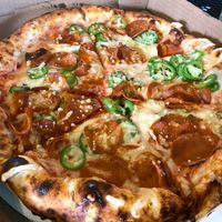 Build you own custom pizza with vegan pepperoni and jalapeños.  at Ozone's Brewhouse in Lansing