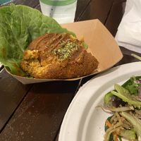 Potato Croquettes (one bite in)  at Peace Cafe in Honolulu