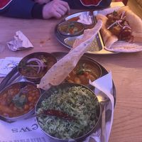 Vegan curry option with the chana, sambar, and eggplant options and a dosa potato masala.   at Ganesh in Brussels