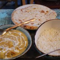 “No chicken” Korma (medium), vegan cheese naan, pilau basmati ricee  at Cinnamon in Sitges