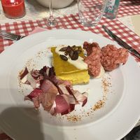 Cheesecake salata alla zucca, mandorle e zafferano, con salsa affumicata alla paprika, semi di zucca tostati e speziati al limone e pepe rosa.  at Agriturismo Biologico La Buona Terra in Cervarese Santa Croce