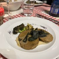 Fettine di seitan rosolato agli aromi freschi, con salsa glassata dolce-acidula, servite su purea di lenticchie rosse e cavolo nero croccante.  at Agriturismo Biologico La Buona Terra in Cervarese Santa Croce