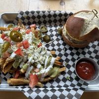 Stuffed burger with loaded fries   at Mexhico Restaurant in Barrie