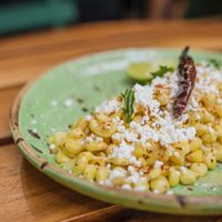 Esquites 
This are grain of corn with vegan mayo and cheese and a twist of lime. at Chela de Playa in Playa Del Carmen