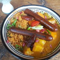 Gemüse Tajine mit zwei veganen Würstchen at Bei Frau Nanna in Frankfurt