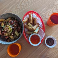 Lychee pork handmade noodles with spring rolls at Belly Worship in Auckland