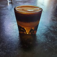 This is an undertow! Vanilla syrup, milk of choice, and a shot of espresso on top. at Spokesman in Austin
