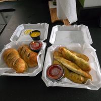 One order each of breadsticks (cheese sticks with no cheese) and custom pepperoni rolls (tofu, vegan cheese, no pepperoni) at The Woods in Huntington