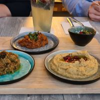 Appetizers (Hummus - lower right, Mirza Ghasemi - upper and lower left, Zeytun Parwarde - upper right) at Mana Mana Delikatladen in Essen