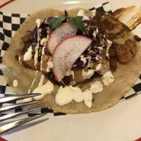 Taco with mole   at Taqueria La Lupe in Sevilla