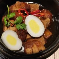 Grandma's clay pot with "pork belly," "eggs", rice and salad at Linh - Not Just A Restaurant in Prague