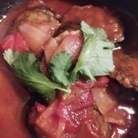 Fish in tomato sauce at Linh - Not Just A Restaurant in Prague