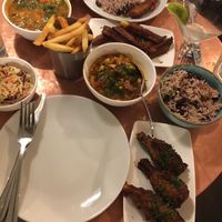 Chicken curry, rice and peas, fries, plantain fries, ackee and codfish, mix n match wings  at Jam Delish in North London