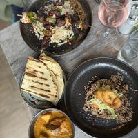 Chicken skewers, roti and goat curry   at Jam Delish in North London