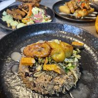 Rice and plantain that comes with curry goat   at Jam Delish in North London