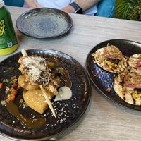 ‘Prawns’ with bammy (cassava bread) on the left, ‘pork belly’ tacos on the right    at Jam Delish in North London