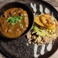 Goat curry, rice and plantain at Jam Delish in North London