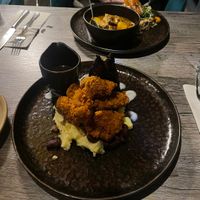 Fried chicken with hispi cabbage and Jamaican gravy  at Jam Delish in North London