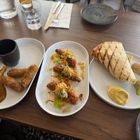 Oxtail spring rolls, fish taco and roti  at Jam Delish in North London