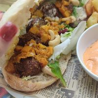 Bocadillo de pan rustico con albondigas de heura, crema de anacardos y calabaza asada con curry at Mitica la Vella in Terrassa