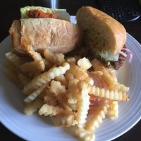 Half of their buffalo sub, half an impossible burger, and a whole lot of fries at Loving Hut in Tampa