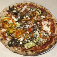 Their vegetarian Pizza but the mozzarella is replaced with their vegan mozzarella, very good at Al Ventitre in Lazise