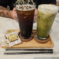 Iced Matcha & American with complimentary biscuits at Began Vegan in Bangkok