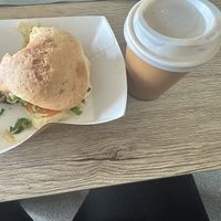 Very small coffee next to the tiny vegan burgerr  at Frocals Kings Beach in Caloundra
