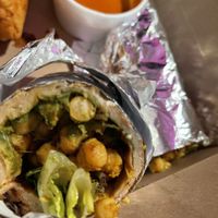 Ugly picture, but the samosa and the naan roll was very tasty. at Greenhaus Eatery in San Diego