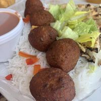 Veggie meatballs with rice, garlic naan and masala sauce.    at Greenhaus Eatery in San Diego