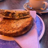 Hummus and roasted veggies toastie with americano  at St Mocha in Balmaha