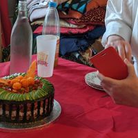 Our friend getting excited about her new 'cakey' experience surprise -getting ready to photograph it. at Fakey Cakey in London