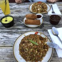 From left: potato curry, passion fruit soda, chk’n kottu, seeni sambal, spicy chk’n kottu, beef rolls w/devil sauce   at Mirisata in Portland