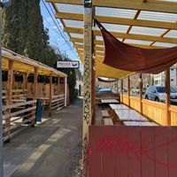 View as walking towards Mirisata. There’s more outdoor seating than the street seating in this photo    at Mirisata in Portland