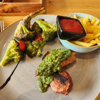 Vegan steak with charred broccoli and fries at Aarmühle in Interlaken