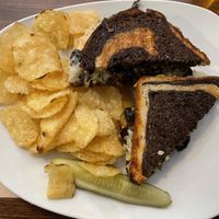 Portobello Reuben with subbed vegan cheese and chips side  at Jules' Bistro in St Cloud