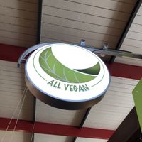 Pictured is the restaurant sign  at All Vegan in Hannover