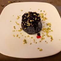 Vegan chocolate lava cake with fruit sauce at Historic Route 66 Pub in Caltanissetta