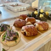 Ordinarie Fare: GF/V baked goods in the case. Roasted radish galette, Pain au chocolat, Black tahini choc chip cookies  at Ordinarie Fare in Dayton